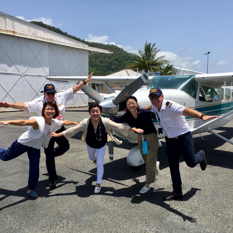 pilots in front of plane
