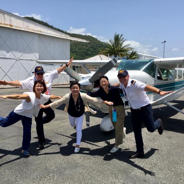 pilots in front of plane
